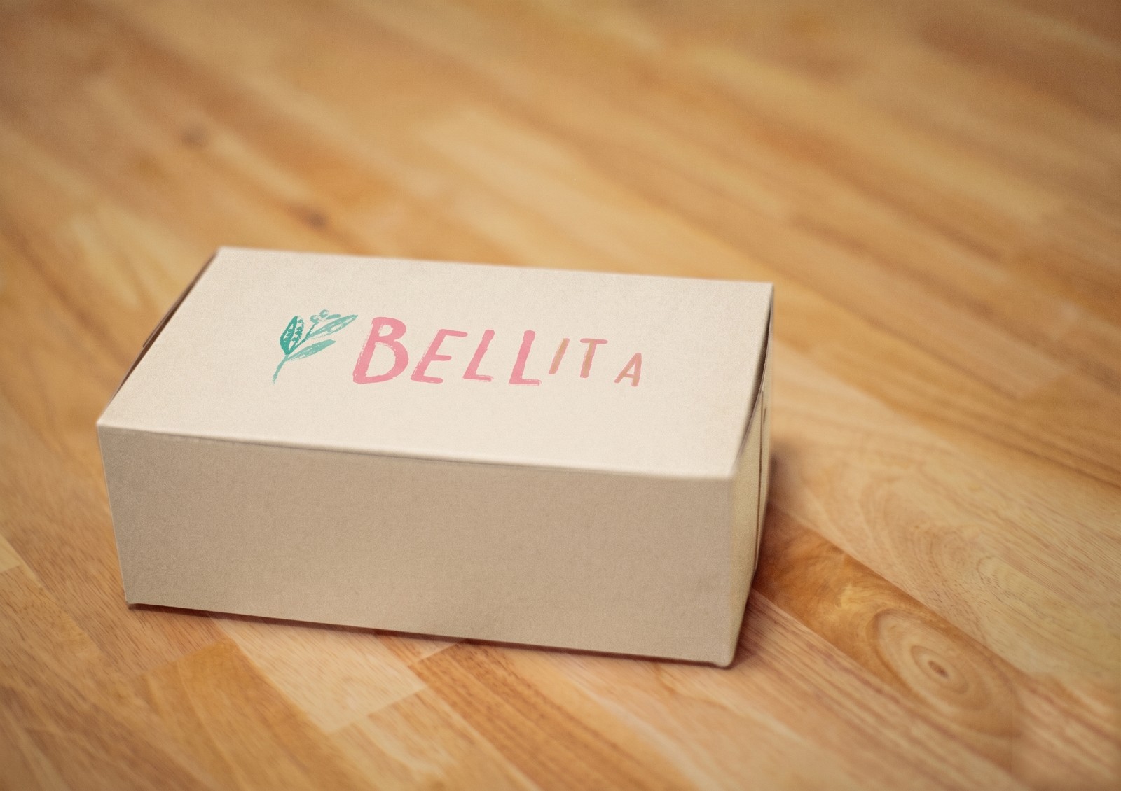 The Bellita gift box on a wooden floor