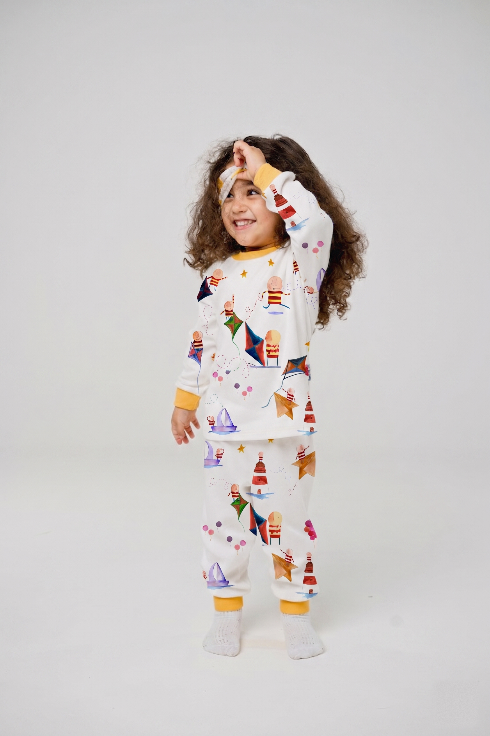 Child wearing the Bellita striped-pattern pyjamas